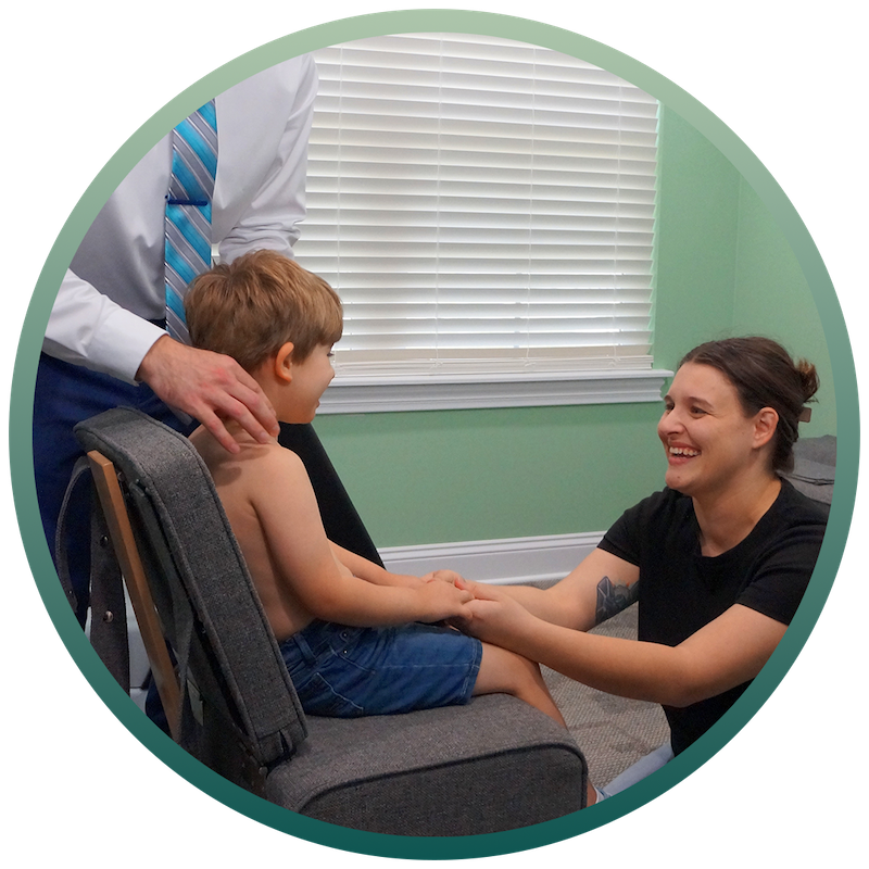 Dr. Neil Barron giving child pediatric chiropractic care